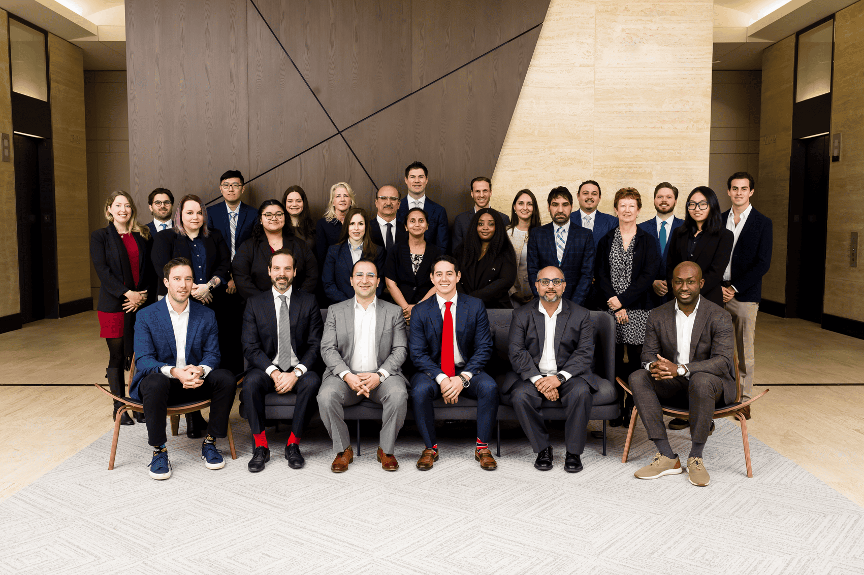 Professional business team group photo at Houston EB5 immigration investment conference in Houston, Texas.
